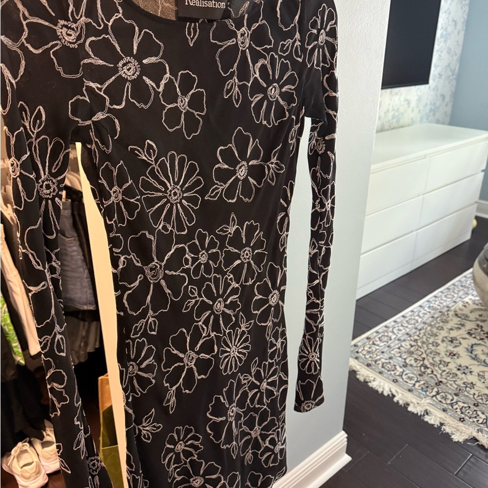 Réalisé Par Black Dress with White Floral Design